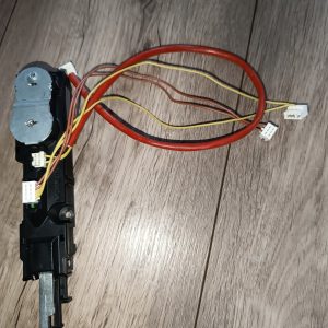 Automotive switch assembly with multiple colored wires and white connectors on a wood floor surface.