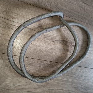 Three gray braided cables coiled on a wooden floor with small metal hooks attached along their length