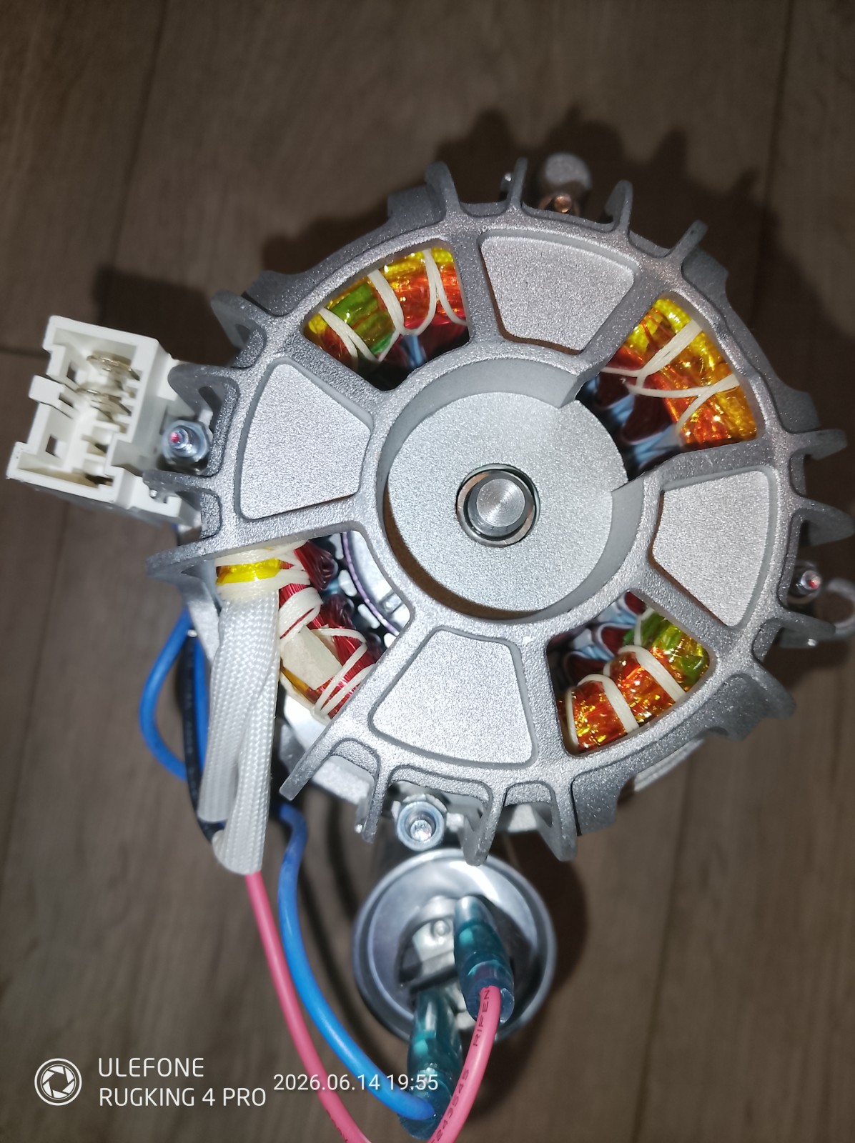 s-l1600-1149.jpg Close-up of an electric motor rotor with exposed copper windings and a white multi-pin connector on the side.