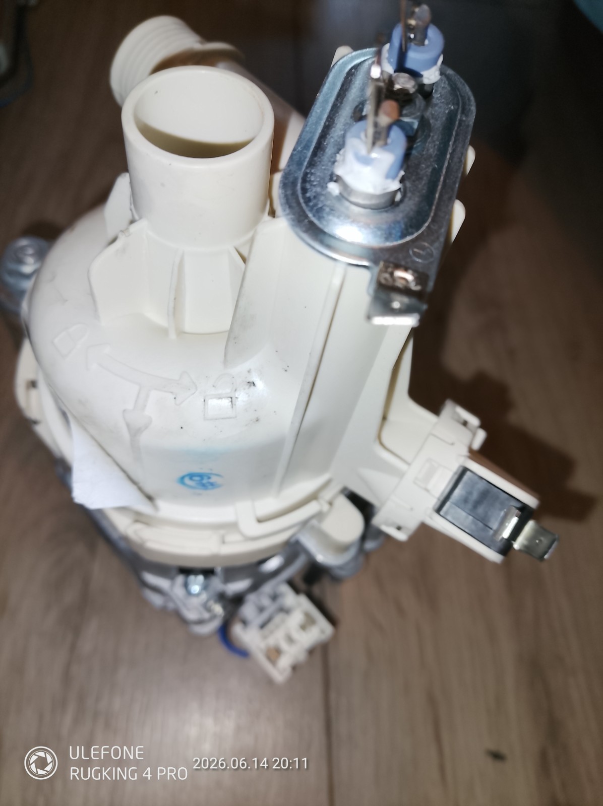 s-l1600-1157.jpg Close-up of a white plastic valve assembly with a metal contact and small electrical connectors, likely part of a plumbing or pump device.