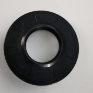 Black circular gasket with a hollow center on a light background, resembling a washer or seal