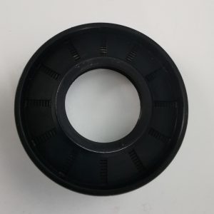Black circular plastic ring with a central bore and evenly spaced rectangular slots around the inner circumference.