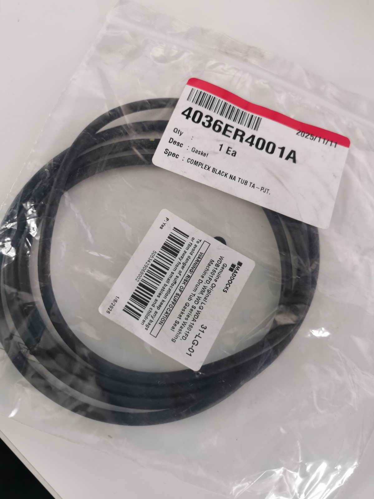 s-l1600-1172.jpg Coiled black cable inside a clear plastic bag with barcode labels on the packaging, ready for sale