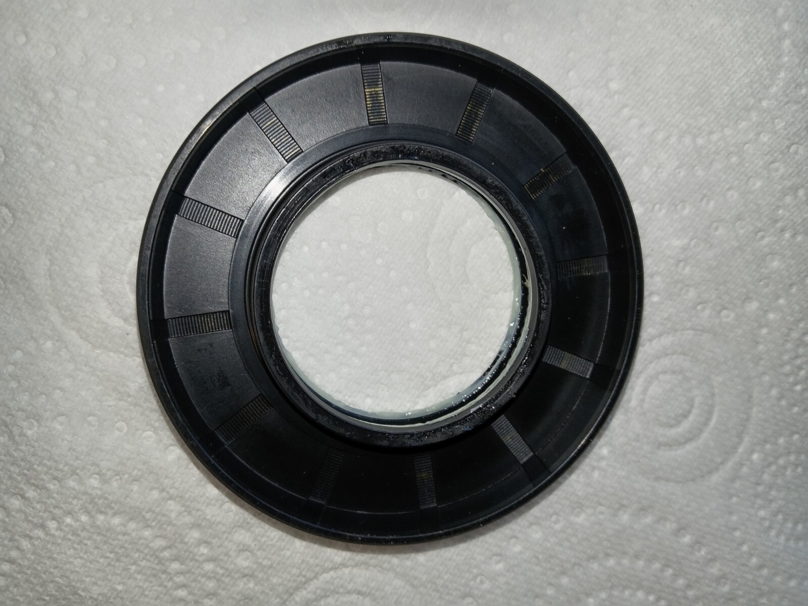 s-l1600-134.jpg Circular black plastic lens mount/adapter ring on a white textured background.