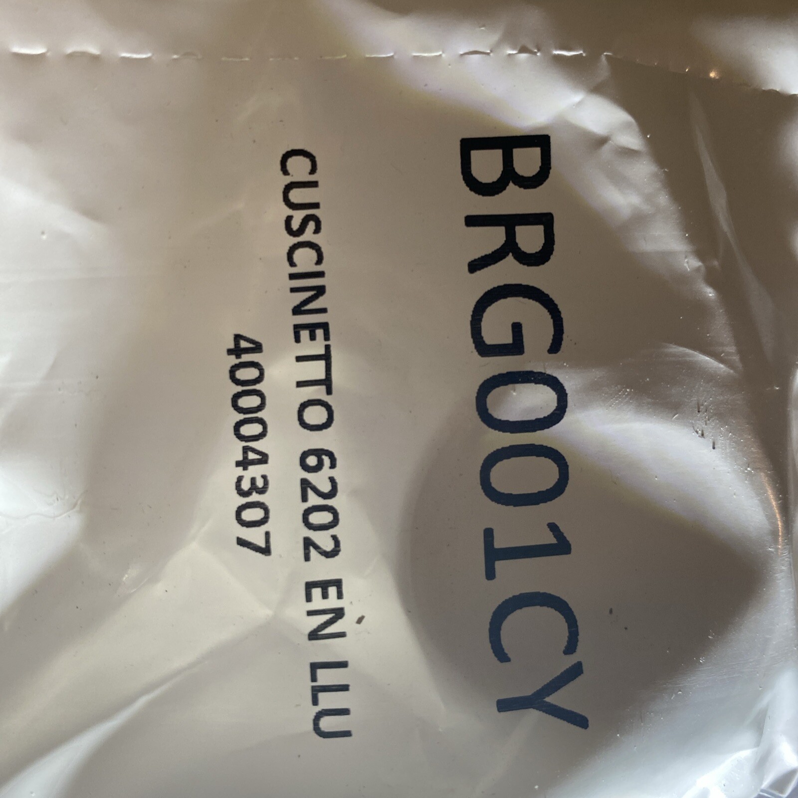 s-l1600-146.jpg Close-up of a crumpled white plastic bag with printed text and numbers partially visible in blue and black.