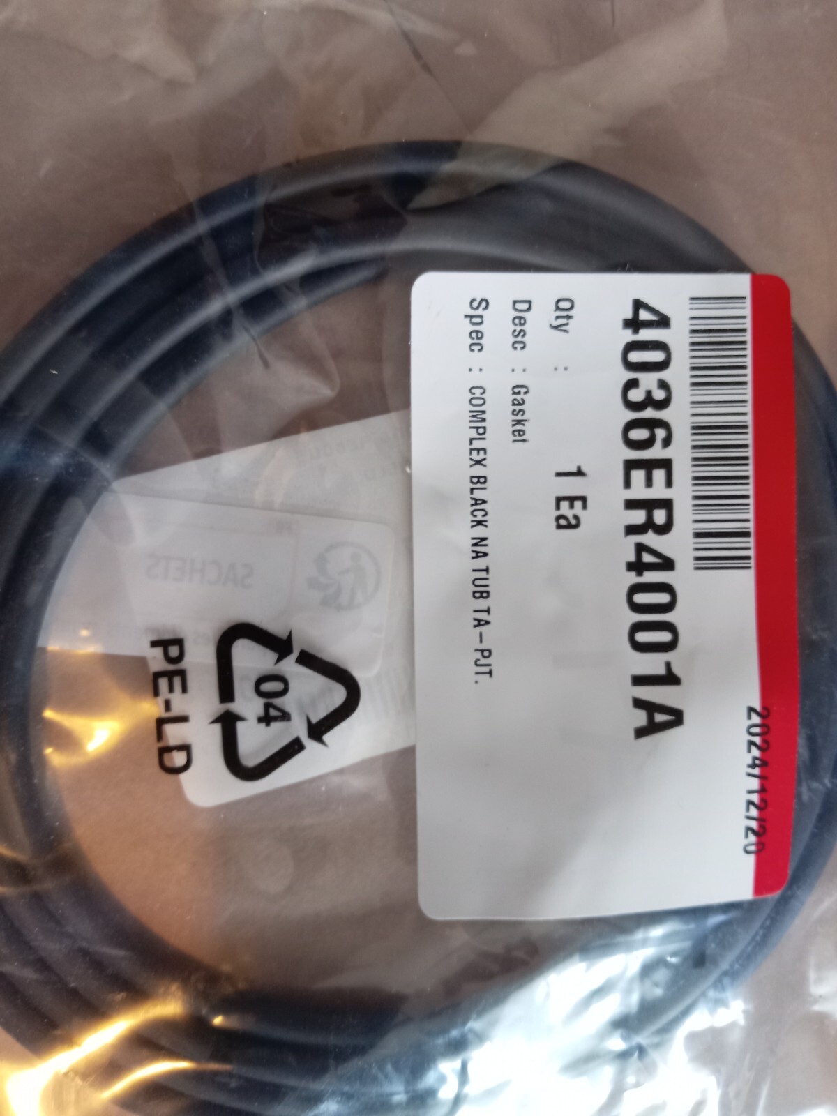 s-l1600-152.jpg Coiled black hose inside clear packaging with a white label showing part number 4036ER40-1A and the description 'Gasket'.