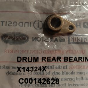 Small bronze drum rear bearing component with a circular hole and mounting tab resting on a labeled plastic bag