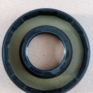 Close-up of a black circular plastic part with an olive-green inner ring and metal inner lip, viewed from above.