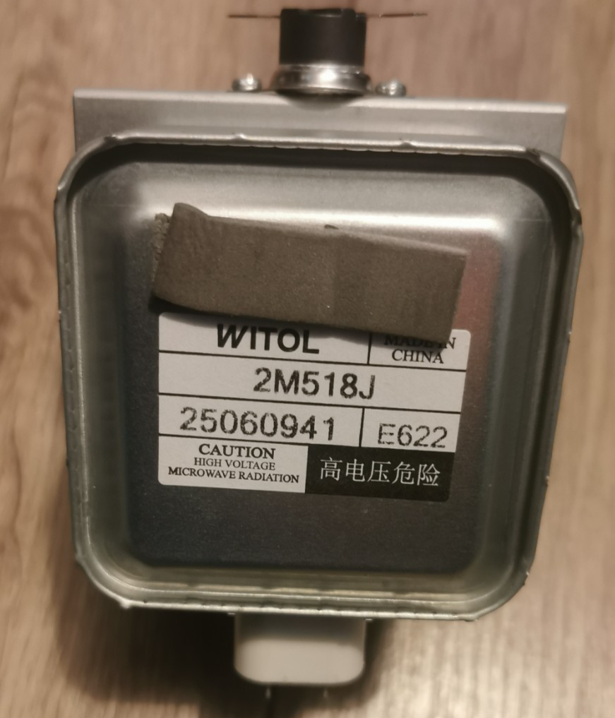 s-l1600-22.png Metal high-voltage transformer in a metal case with the label 'WITOL 2M518J' and a microwave radiation warning.