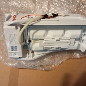 White electrical module with red and beige wires, label and QR code, resting on bubble wrap.