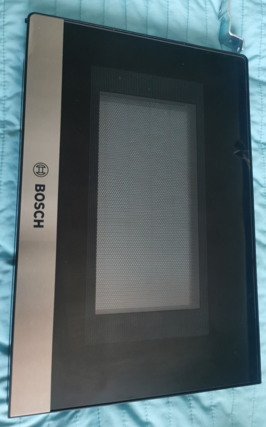 s-l1600-25.png Bosch-branded kitchen appliance door with a brushed metal strip on the left and a large glass viewing window