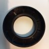 Close-up of a black circular camera lens mount on a light surface.