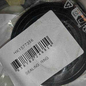 Coiled sealing ring inside plastic packaging with a barcode label showing part number HK1577356.