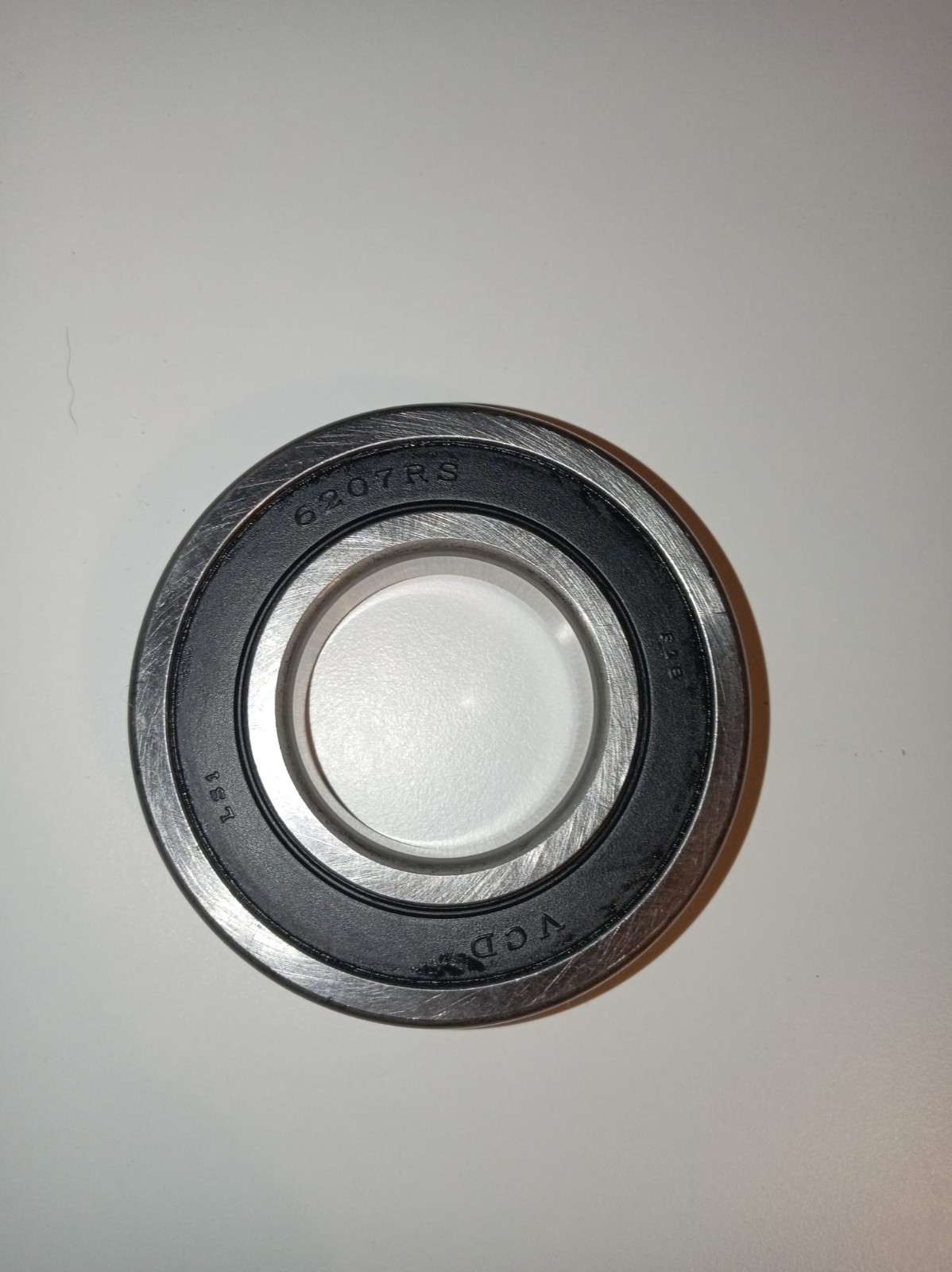 s-l1600-313.jpg Radial ball bearing with inner and outer rings, stamped with 6207RS on the outer race.