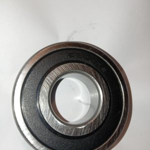 Close-up of a metal ball bearing with inner bore and outer race visible.