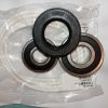 Set of ring-shaped oil seals (rubber and metal) in a clear plastic bag, showing inner bore holes and size markings on the rings, ready for installation