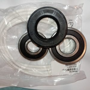 Set of ring-shaped oil seals (rubber and metal) in a clear plastic bag, showing inner bore holes and size markings on the rings, ready for installation