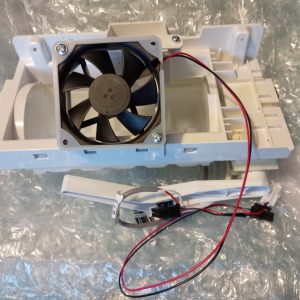 White plastic electronic housing with a mounted black cooling fan and red/black wiring harness exposed