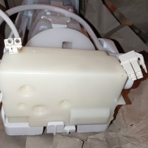 Close-up of a white plastic electrical housing with two plug connectors and attached cables.