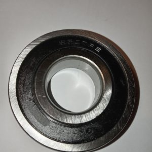 Top view of a metal ball bearing showing inner race, outer race, and bore on a white background