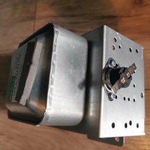 Metal electrical transformer with a mounting bracket, showing terminal screws and a coil housing on the side.