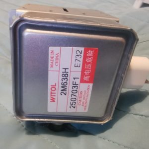 Close-up of a square metal electrical transformer with a red-and-white label reading 'WITOL' and 'MADE IN CHINA' on a quilted blue surface.