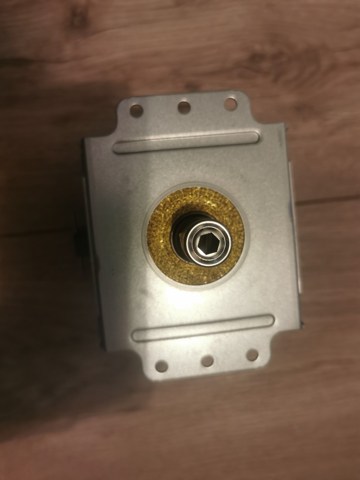 s-l1600-666.jpg Close-up of a metal lock cylinder set in a metal plate, with a brass ring around a hexagonal key socket