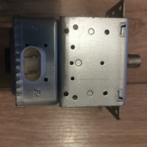 Electrical control module with a plastic connector on the left and a perforated metal housing on the right, likely an automotive radio/stereo component.