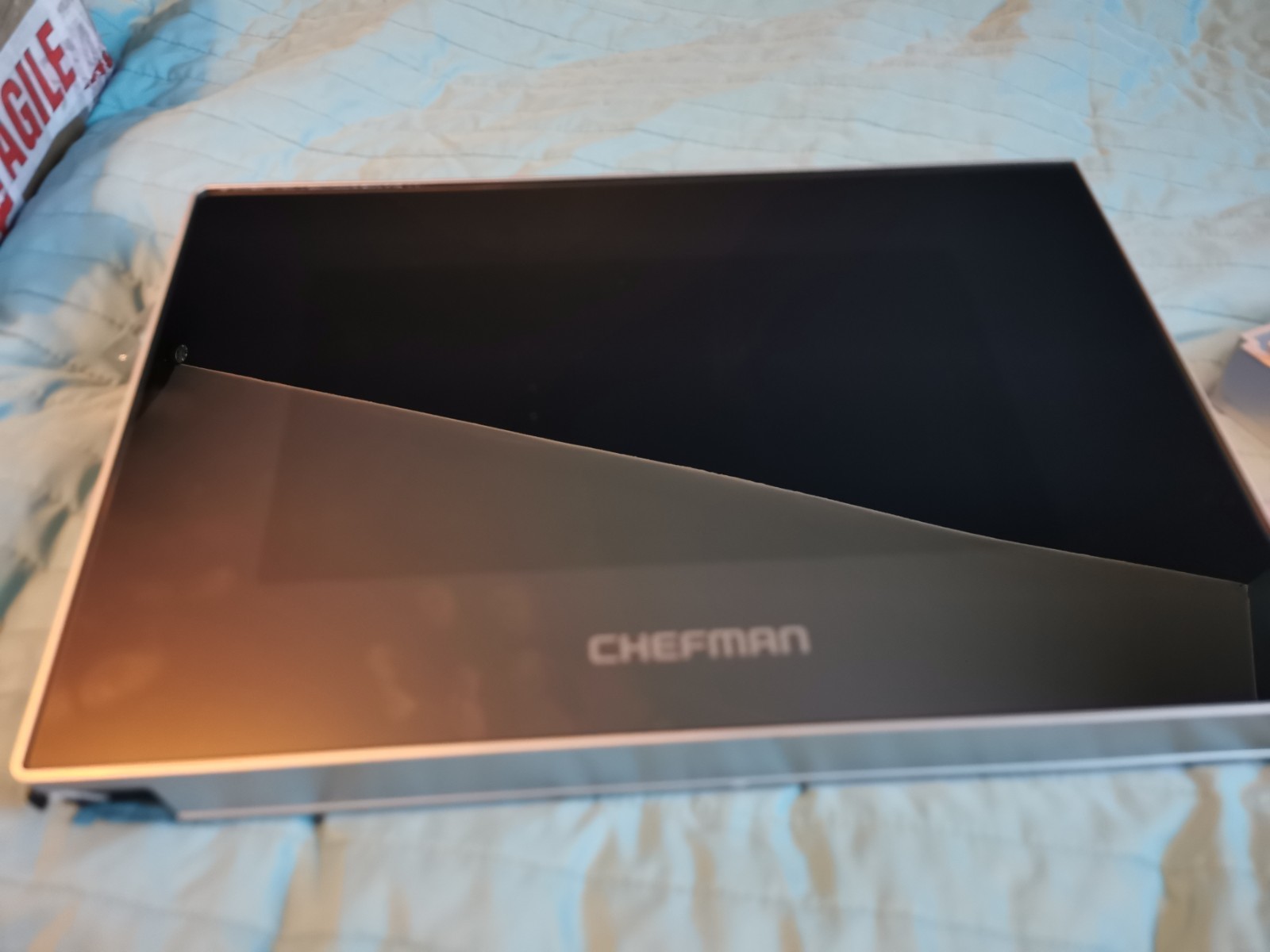 s-l1600-704.jpg Open Chefman box with black interior on a blue quilted bedspread, lid raised to show empty cavity.