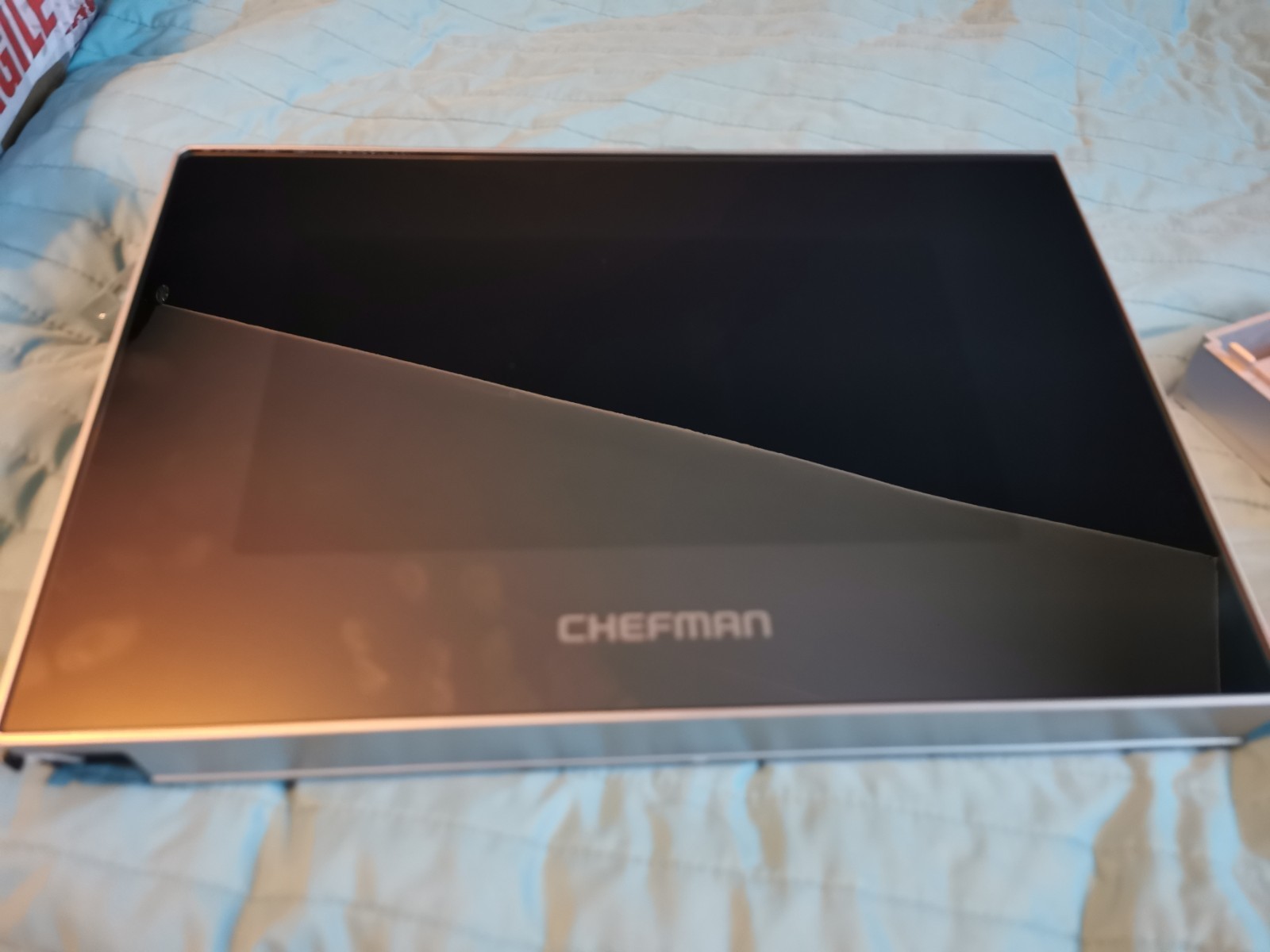 s-l1600-705.jpg Opened CHEFMAN box with a black interior resting on a blue quilted bedspread around the edges visible.