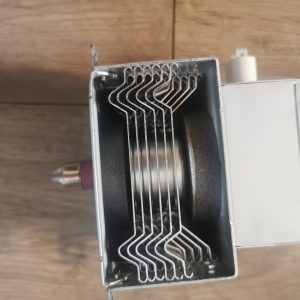 Open toaster oven showing metal rack supports and a baking chamber for toasting or baking items inside.