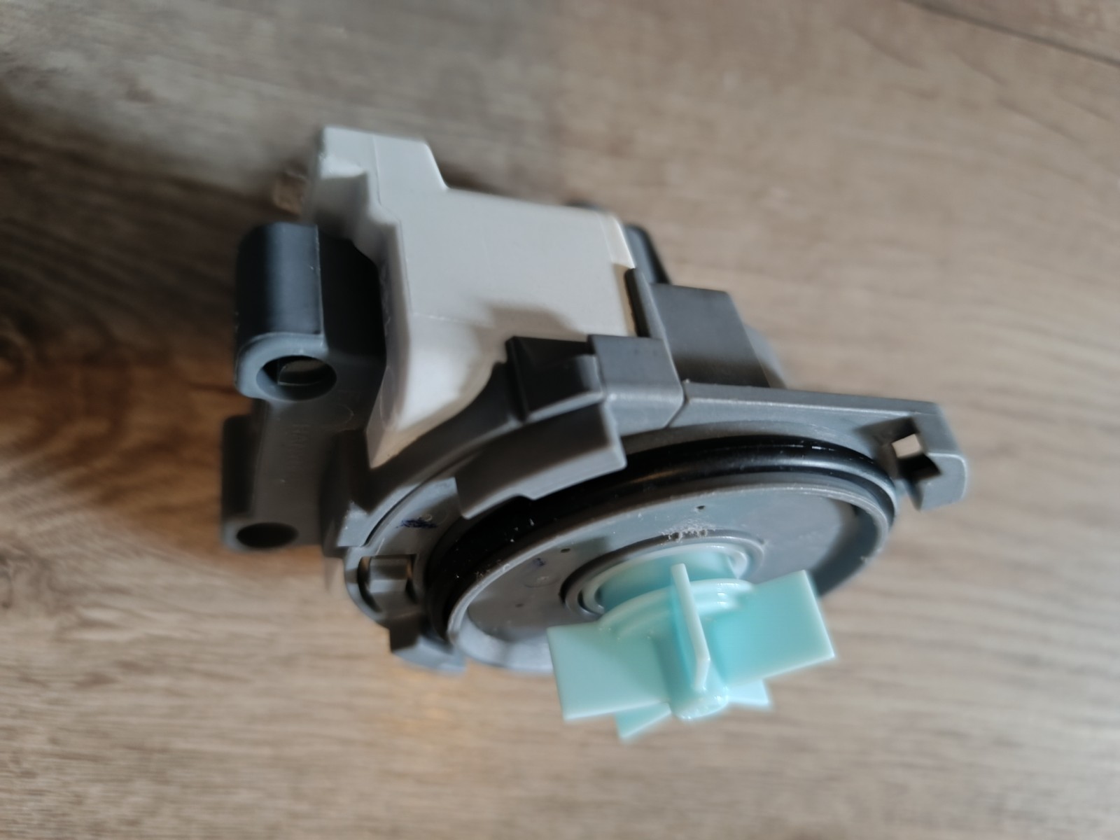 s-l1600-907.jpg Close-up of a gray LEGO Technic assembly with a teal connector piece and exposed axle hole