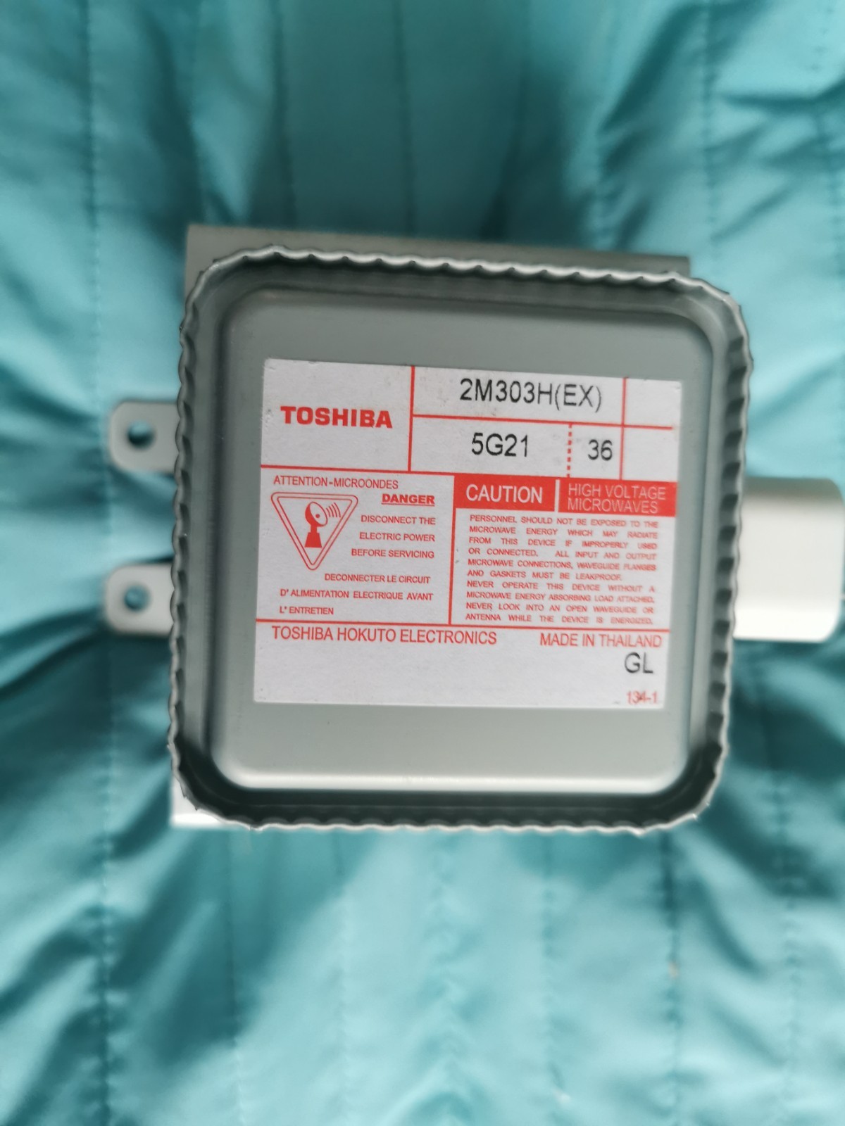 s-l1600-963.jpg Close-up of a Toshiba electronic component label showing model 2M303H(EX), 5G21, with warnings about high voltage microwave use.