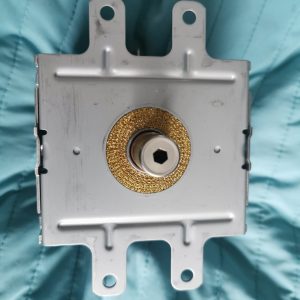 Back view of a metal electrical switch mounting module with three top mounting ears and a central brass bushing/shaft.