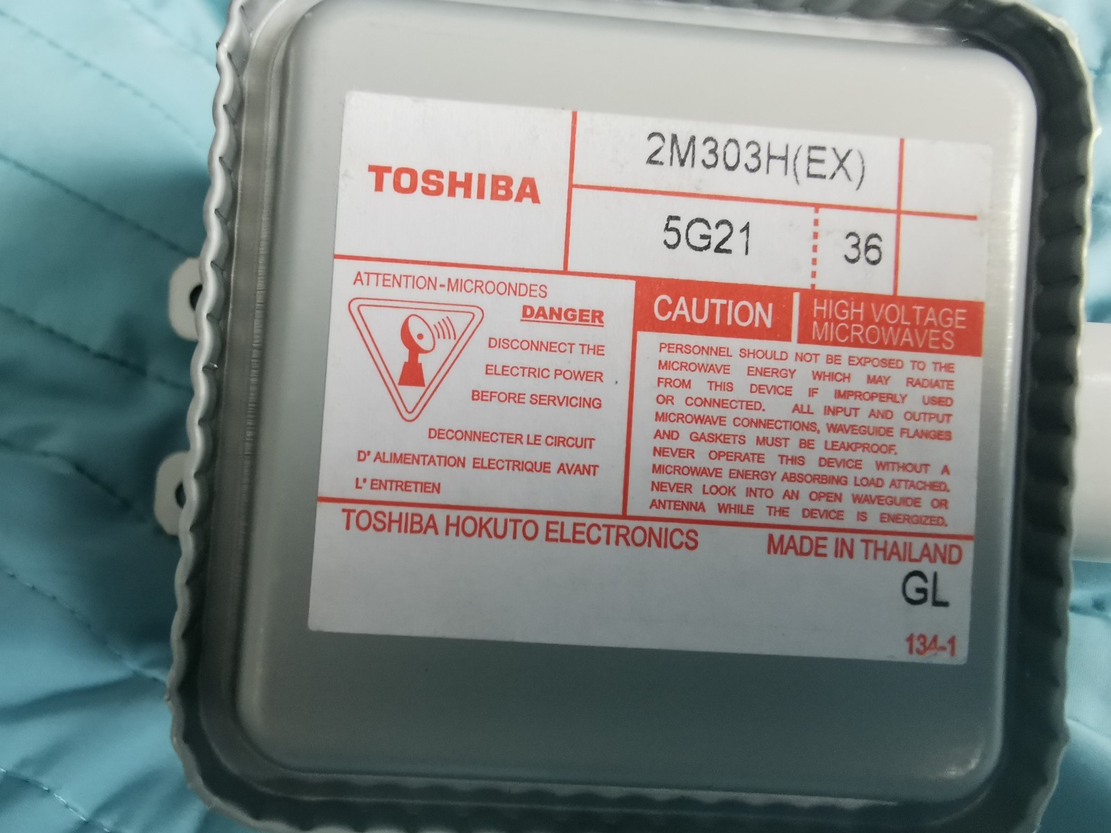 s-l1600-966.jpg Close-up of a Toshiba microwave transformer label showing model 2M303H(EX) and high voltage caution text.